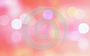 Abstract multicolor blurred bokeh light on light pink photo