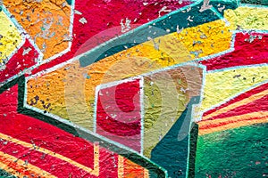 Abstract multicolored graffiti drawings. Wall painting Yellow, red and green. Cement background with texture