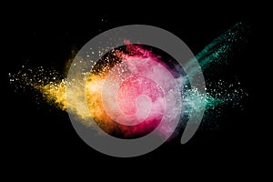 Abstract multicolored powder explosion on black background