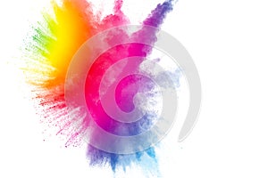 Abstract multicolored powder explosion on white background.