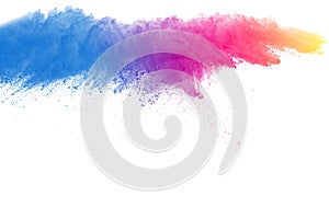 Abstract multicolored powder splatted on white background photo