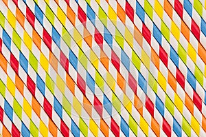 Abstract multicolored rainbow geometric striped background of beverage straw.