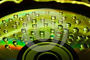 Abstract music background, water drops on CD/DVD