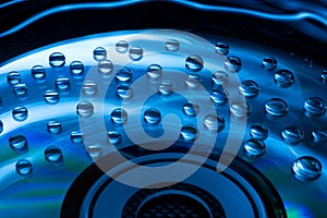 Abstract music background, water drops on CD/DVD