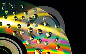 Abstract music background, water drops on CD/DVD