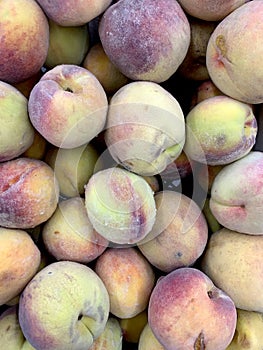 Abstract natural background ripe peaches, selective focus