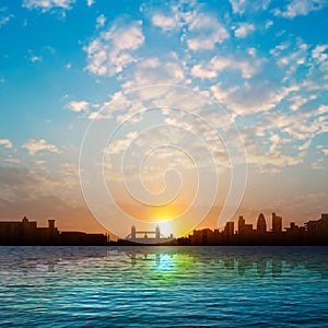 Abstract nature background with silhouette of London and sunrise
