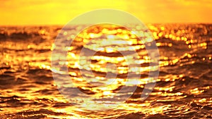 Abstract nautical summer ocean sunset background with blurred waves, sun reflections, and bokeh. Seamless panorama and