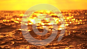 Abstract nautical summer ocean sunset background with blurred waves, sun reflections, and bokeh. Seamless panorama and