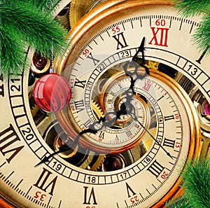 Abstract New Year clock with red ornament ball on green Christmas tree background. Happy New Year 2018 card Christmas time