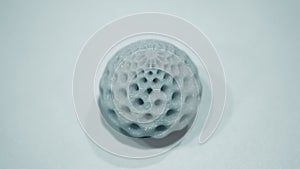 Abstract object of a blue color printed by 3d printer on white