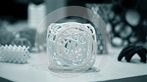 Abstract object of a blue color printed on a 3d printer on a white table