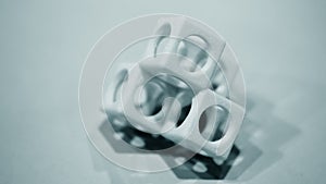 Abstract object of a blue color printed on a 3d printer on a white table