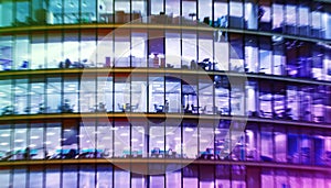 Abstract office bulding with people working