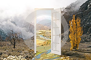 Abstract open door leading to beautiful landscape. Dream and success concept.