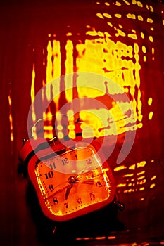 Abstract orange background with a clock