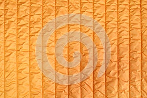 Abstract orange background. Fashionable Quilted Orange Fabric