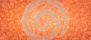 Abstract orange background texture with white scratched lines and bokeh circles in detailed distressed grunge