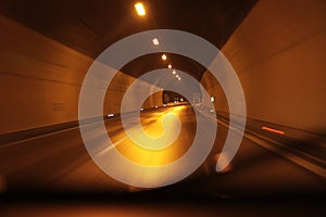 Highway tunnel at night . Motion blur