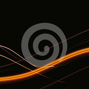Abstract Orange Light Trails on Dark Background