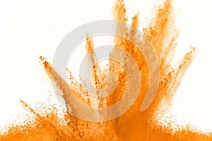 Abstract orange powder splatted background. Colorful powder explosion on white background. Colored cloud. Colorful dust explode. P