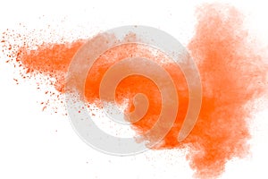 abstract orange powder splattered on white background