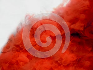 Abstract orange and red smoke on white background.