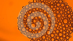 Abstract orange water background and transparent soap bubble pattern