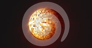 Abstract orange yellow mirrored round disco ball for discos and dances in nightclubs 80s, 90s luminous background