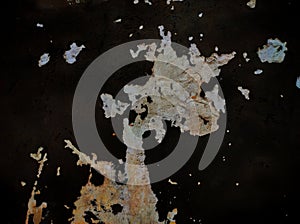 Abstract Paint cracking off dark wall.Grunge wall texture background.