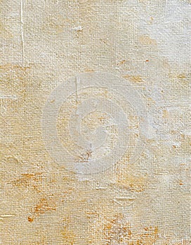 Abstract painted canvas in beige oil paint with textile texture background