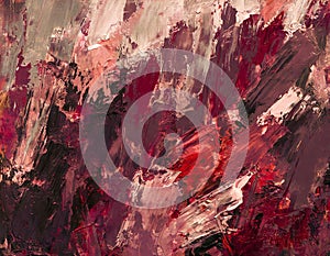 Abstract painted canvas in shades of red oil paint with a dark bottom palette knife texture background