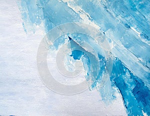 Abstract painting canvas in white oil paint with blue painted corner of palette knife texture