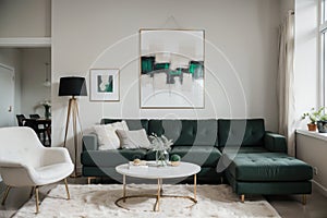 Abstract painting on grey wall o contemporary living room interior with emerald green armchair with round pillow, commode and couc