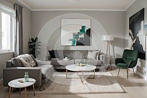 Abstract painting on grey wall o contemporary living room interior with emerald green armchair with round pillow, commode and couc