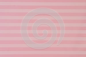 Abstract paper background in yellow and pink stripes. Horizontal shot