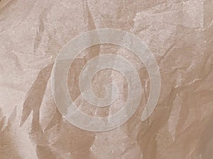 Abstract paper texture. Wrinkled brown paper as an interesting background.