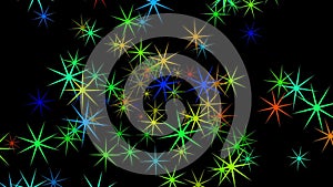 Abstract particles resembling stars of red, yellow, green, blue colors on a black background resemble a festive fireworks display