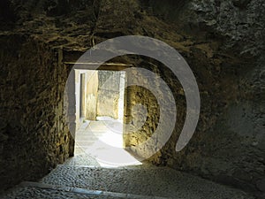 Abstract passage to liight in a medieval castle wall