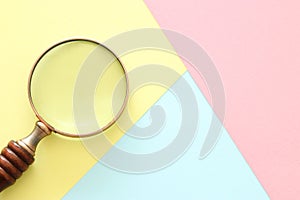 Abstract pastel colored paper texture. Minimal geometric shapes and lines. trendy design concept. vintage magnifying glass.