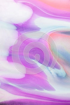 Abstract pastel marbled background with swirls in blue, yellow, and pink hues.