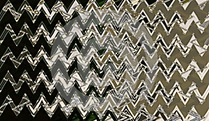 Abstract pattern background with zigzag and waves in black, beige, and brown, tones. Artistic image processing created