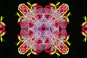 Abstract pattern of multicolored threads on a black background