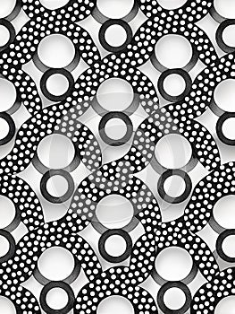Abstract pattern featuring interlocking black and white circular designs. Black circles