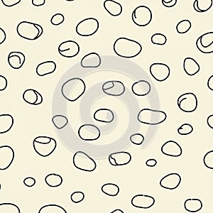Abstract pattern featuring irregular black circles on a light beige background. The