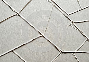 Abstract pattern featuring irregular, overlapping shapes with raised edges on a