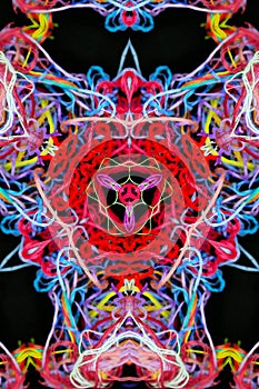 Abstract pattern of multicolored threads on a black background