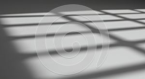 Abstract pattern of rectangular shadows cast on a smooth, light-colored surface. The