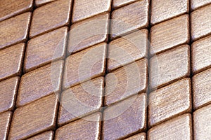 Abstract pattern of rhombus brown bamboo wood pieces