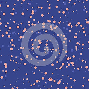 Abstract pattern with speckles pink color on blue background